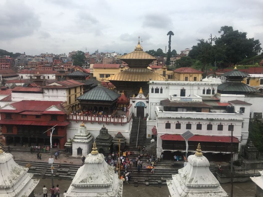"Explore Kathmandu Rich Heritage: City Highlights Bus Tour" - Boudhanath Stupa and the Kathmandu rhythm of religious landmarks