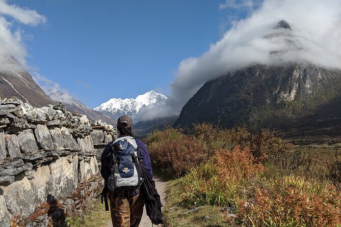 Private 8 - Day Langtang Trekking - Day 4: toward Kyanjin Gompa with prayer flags and stone walls